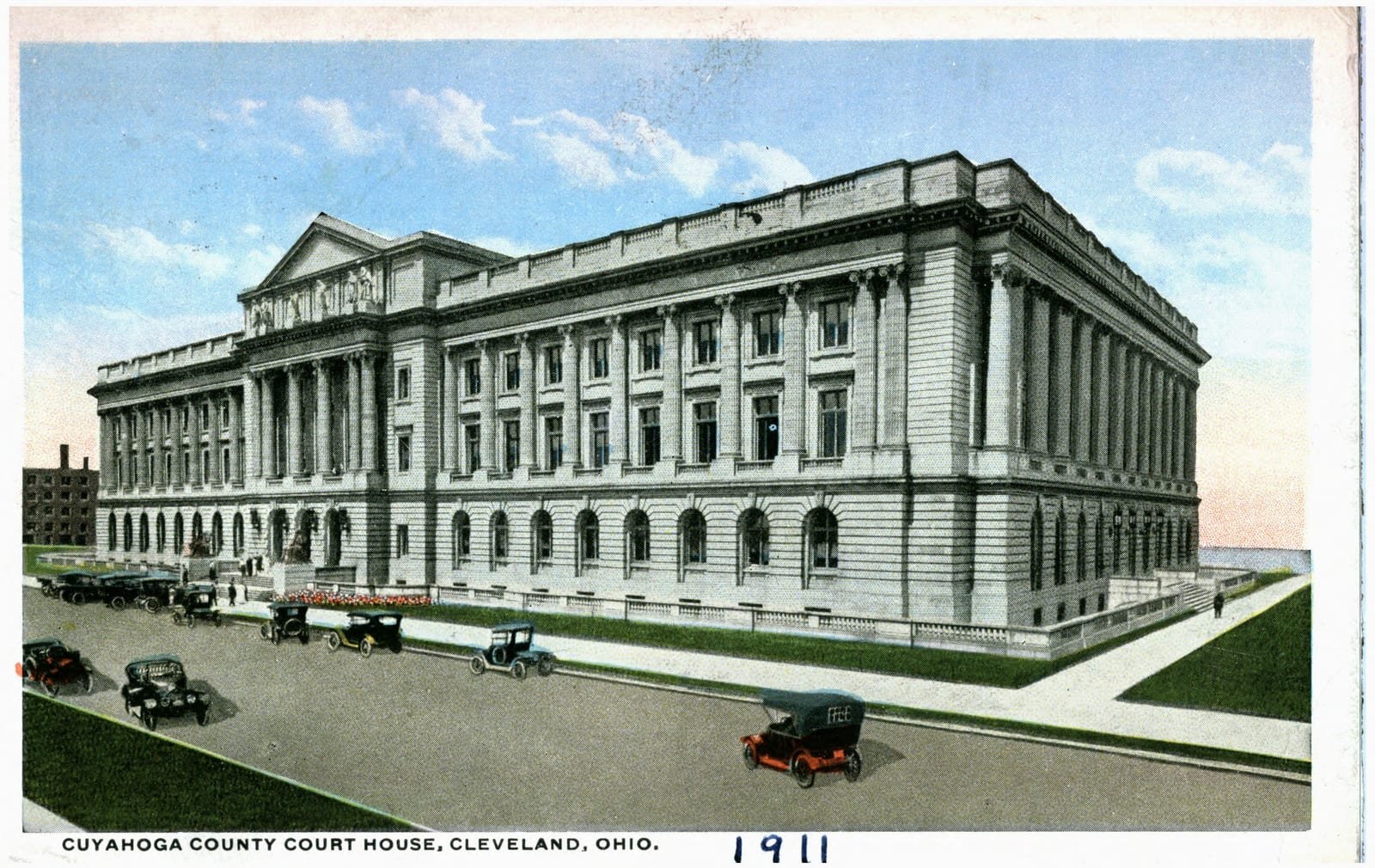 Illustrative image: a 1911 coloured postcard of the Cuyahoga County Court House in Cleveland, with early cars in front.